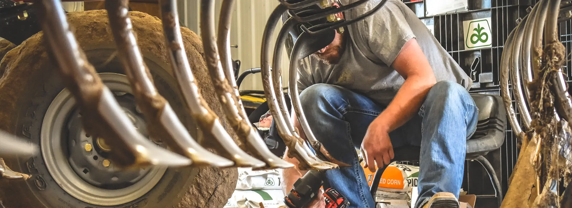 Farmer Working on Chisel Plow