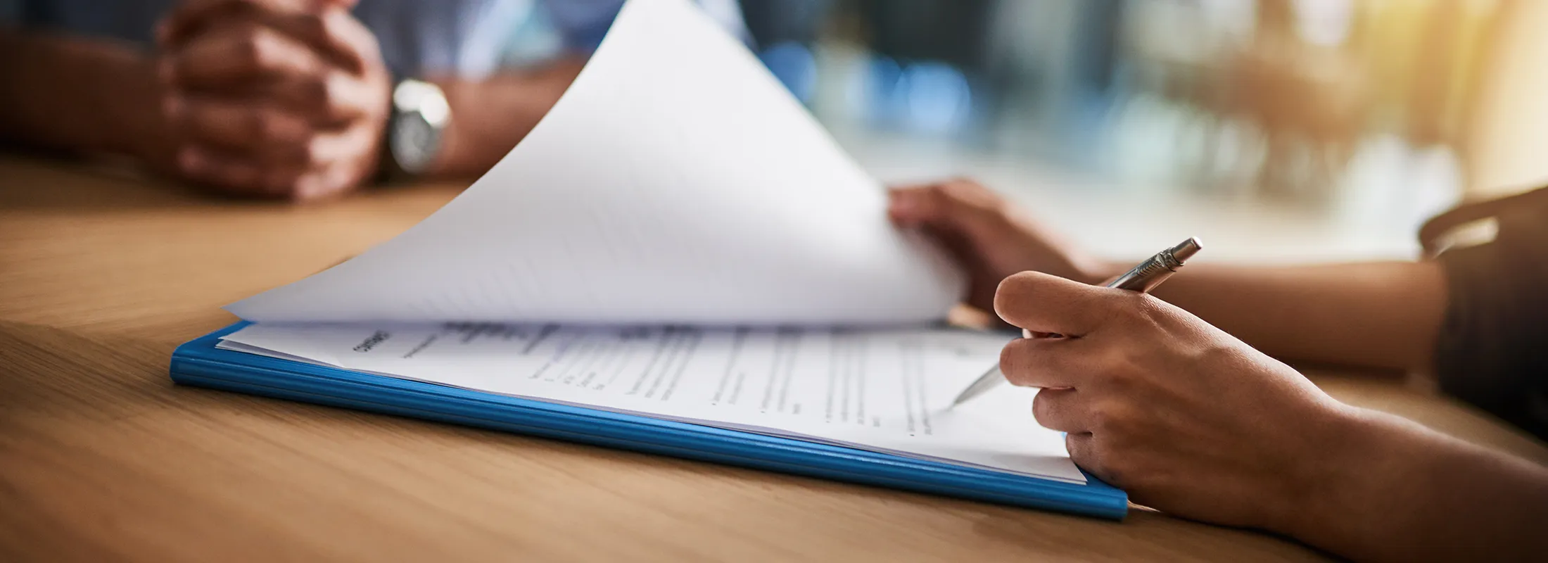 a person signing a document